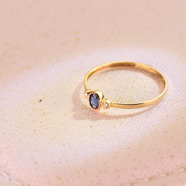 18K SORTIJA ORO AMARILLO PIEDRA AZUL Y CIRCONITA 4X3 MM ANCHO CUERPO 1.2 MM - Imagen 2