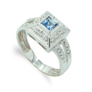 18K SORTIJA ORO BLANCO CON CIRCONITASY PIEDRA AZUL. MOTIVO CUADRADO 10X10 MM