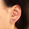 18K PIERCING OREJA ORO AMARILLO HOJITAS CON CIRCONITA 9X6 MM ( UNIDAD ) GRUESO BARRA 1.20 MM LONGITUD 7 MM TOTAL PIERCING 10 MM CIERRE TUERCA - Imagen 2